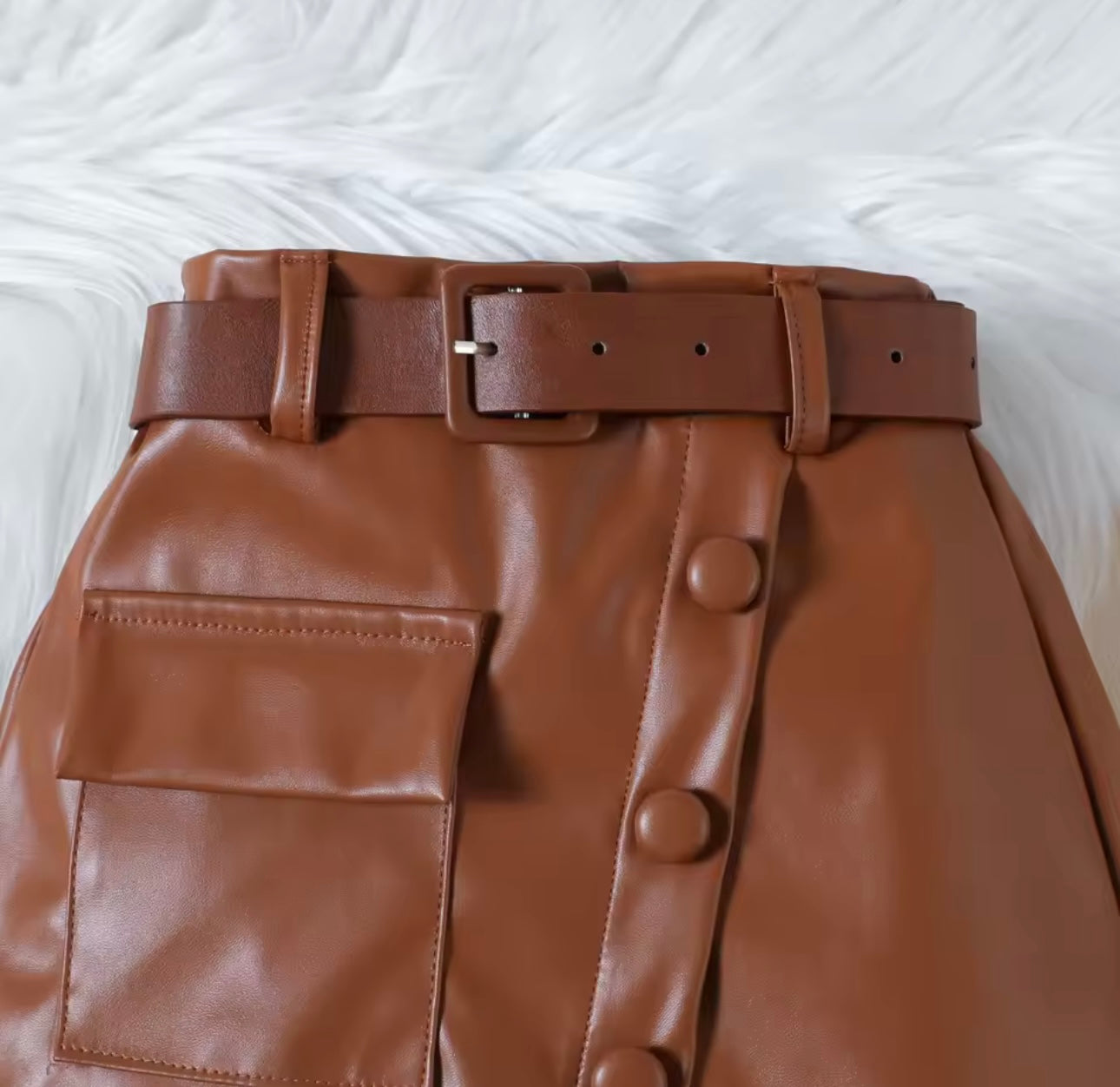 Black ribbed top with mesh sleeve & leather skirt with belt