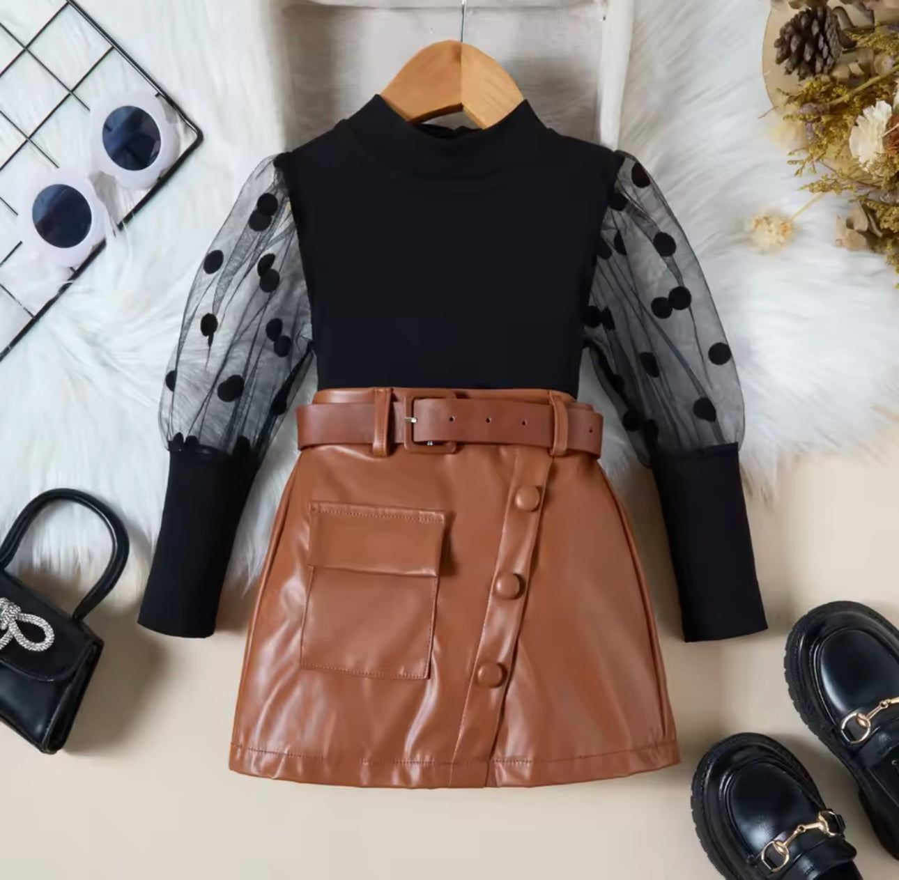 Black ribbed top with mesh sleeve & leather skirt with belt