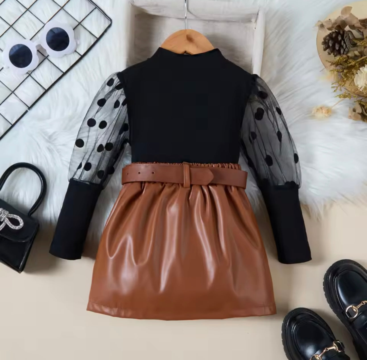 Black ribbed top with mesh sleeve & leather skirt with belt